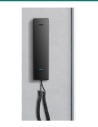 Akuvox S560 black SIP audio handset mounted on a wall — front