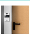 Akuvox R20A silver door phone mounted beside a narrow door