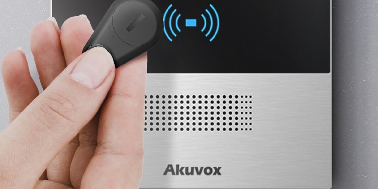 Hand holding the Akuvox Bkey near an Akuvox door phone