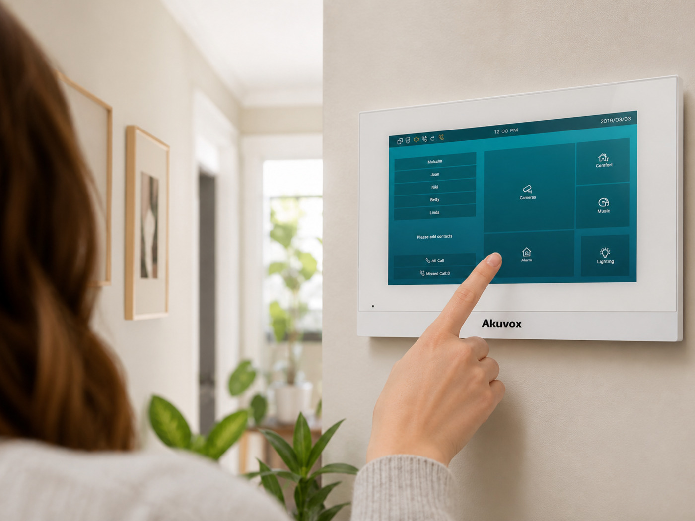 Resident answering a visitor on an Akuvox C313 white indoor unit