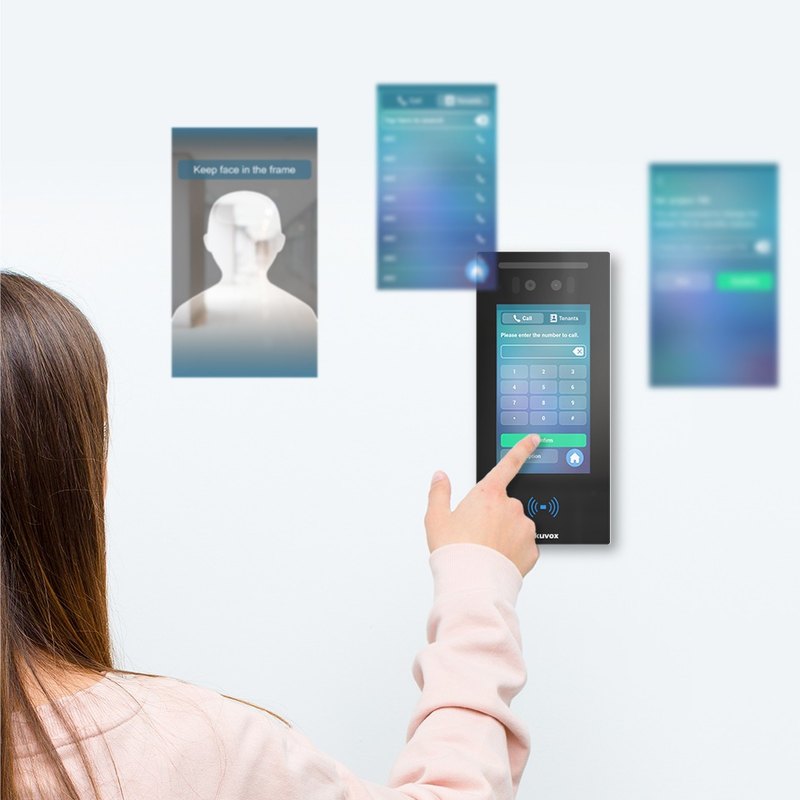 Visitor using the Akuvox E16 touchscreen dial pad