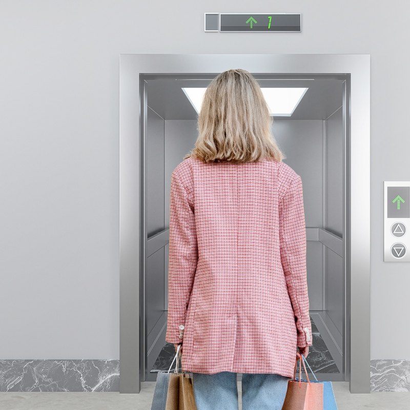 Resident at a lift lobby with Akuvox lift control