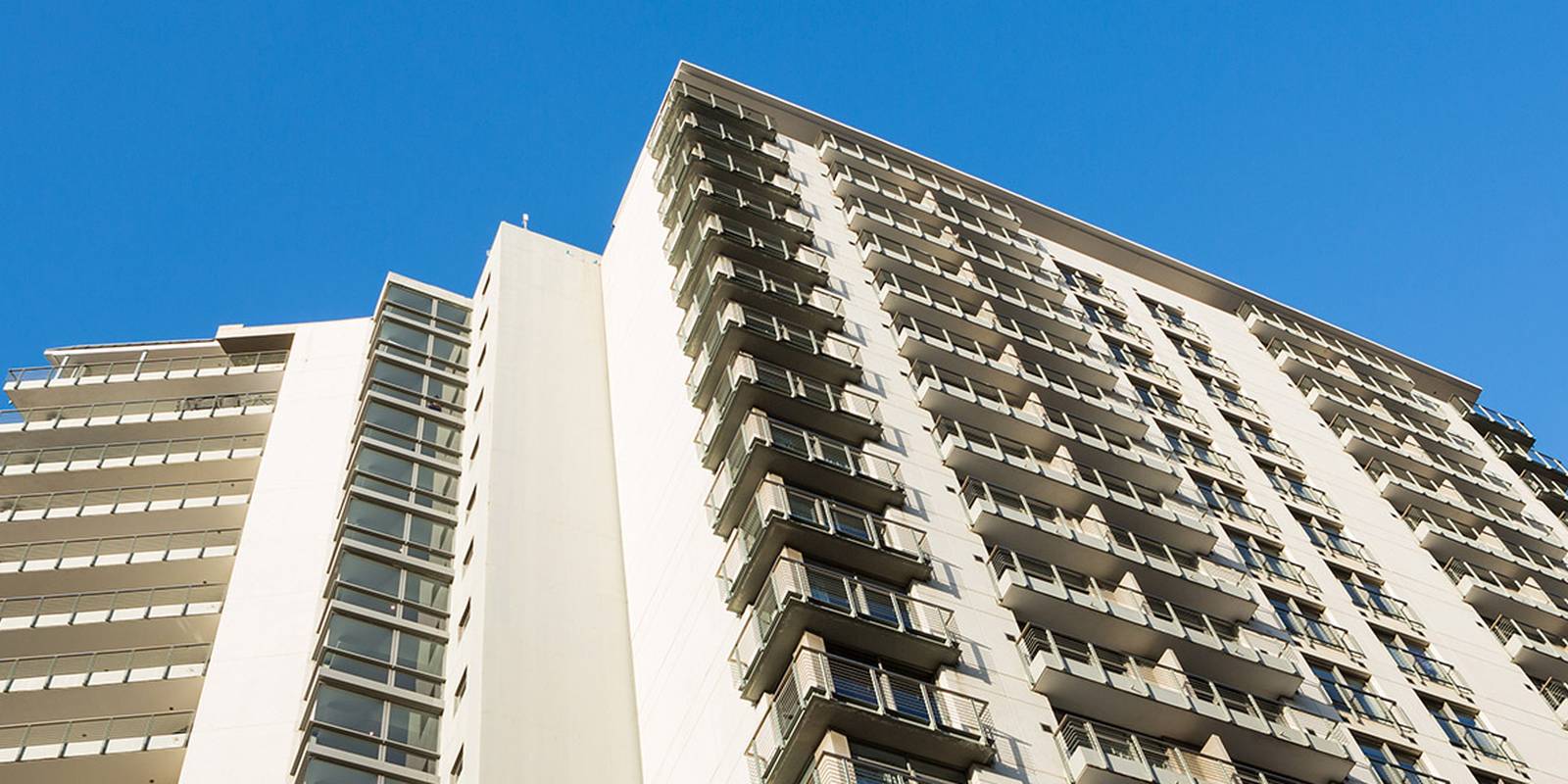 Apartment tower — the kind of existing building the Akuvox NS-2 brings onto IP over its old intercom pairs