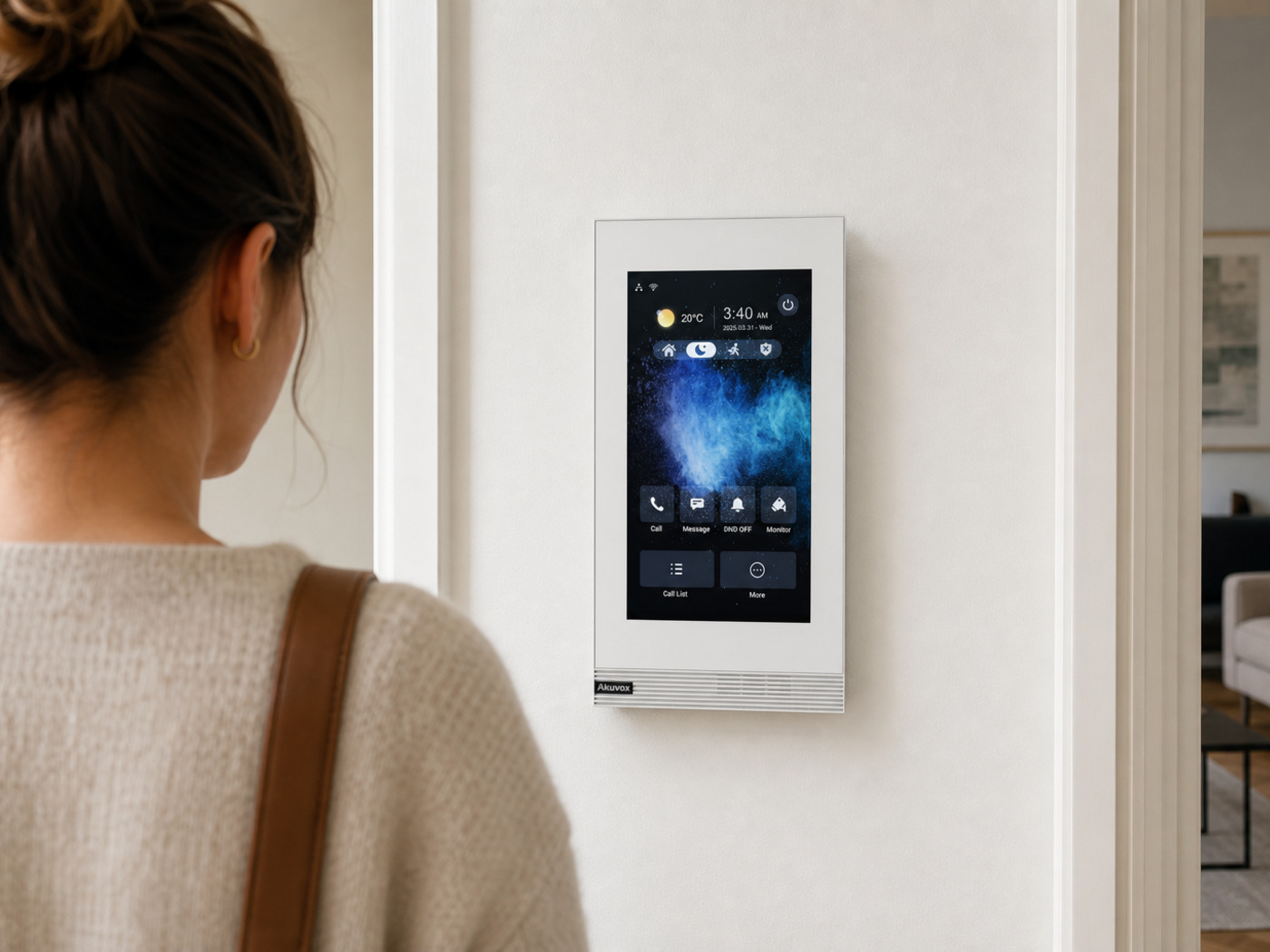 Resident answering a door call on an Akuvox indoor monitor