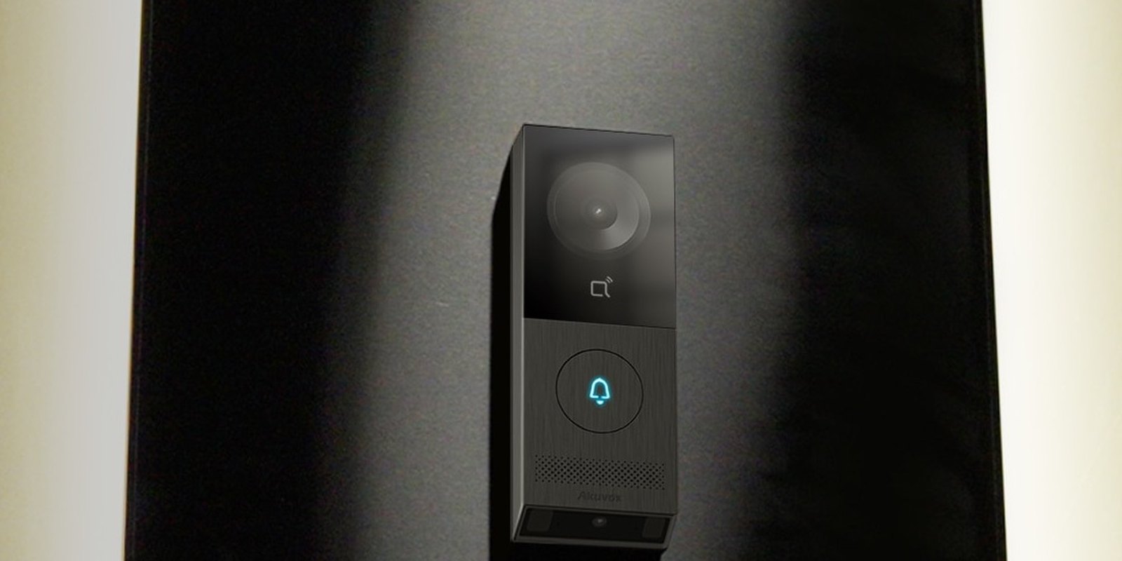Akuvox X910 single-button door phone on a dark timber wall