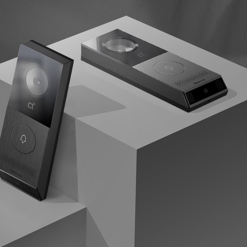Akuvox X910 dark-tone door phone on a concrete plinth