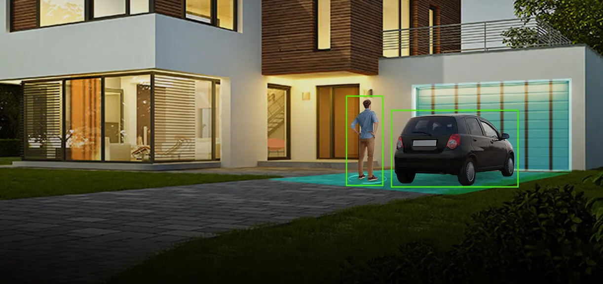 Human and vehicle detection boxes on a driveway at dusk