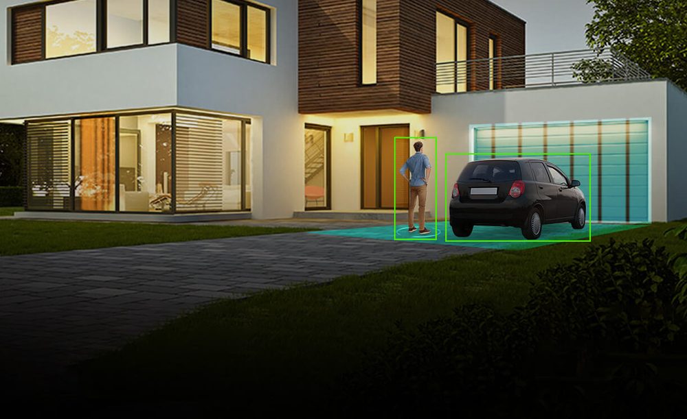 House at dusk with a person and a car outlined by smart detection