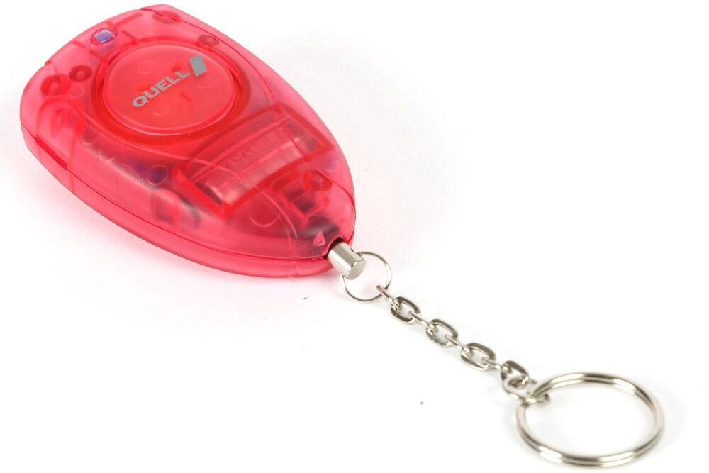 Close-up of a genuine Quell red translucent personal panic alarm with QUELL silver button and metal keychain