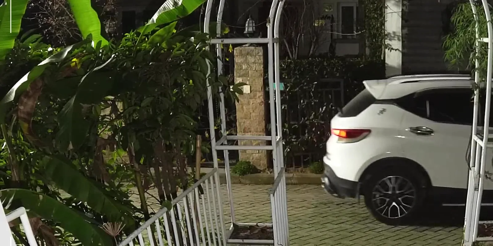 A TP-Link VIGI camera recording a street in full colour at night