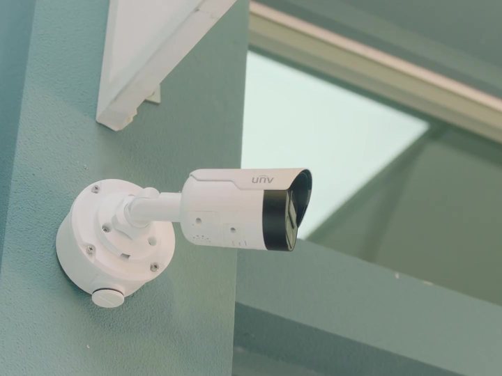 Uniarch Tri-Guard bullet camera mounted under an eave