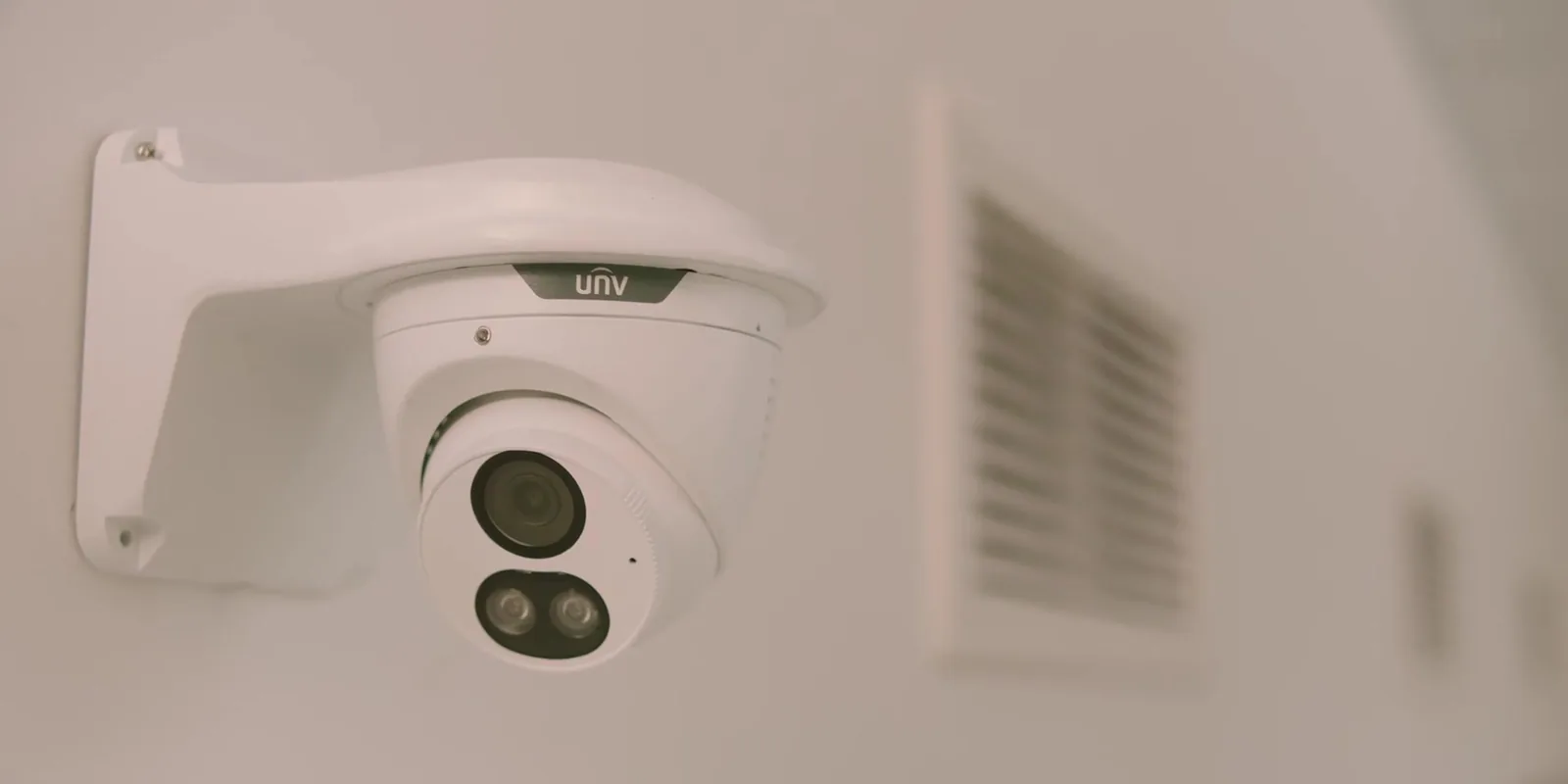 Uniarch Tri-Guard turret camera on a wall bracket